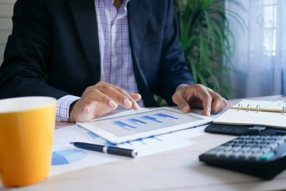 Owner reviewing property financial reports on a tablet